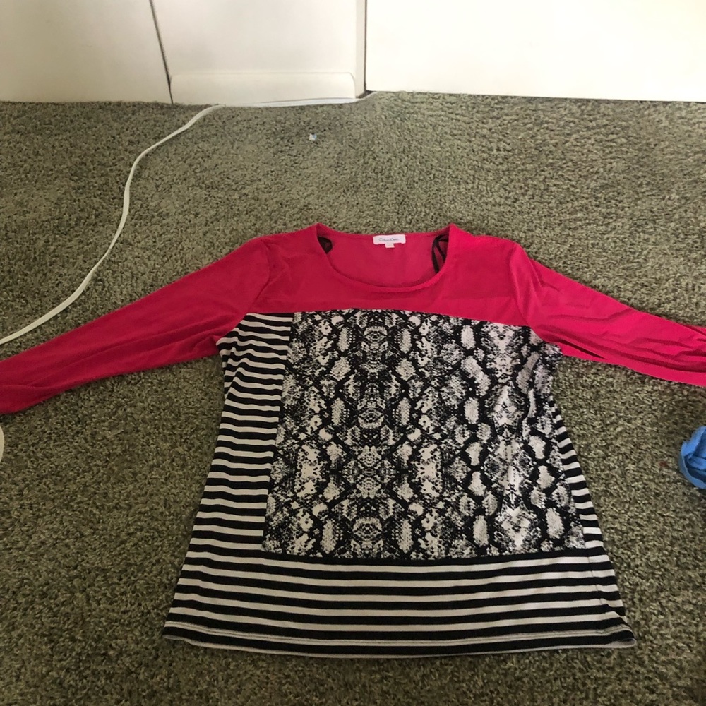 A pink Calvin klein shirt